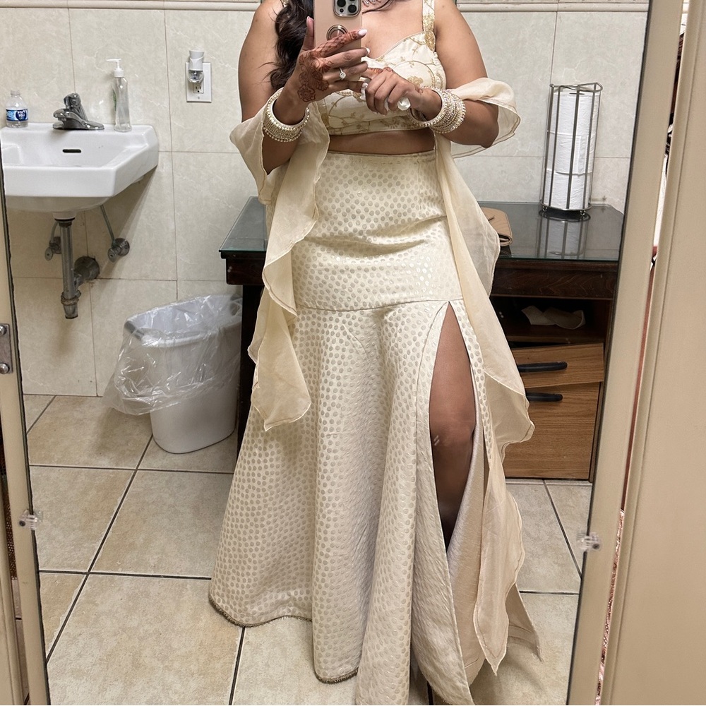 Elegant Cream Lehenga with Gold Accents